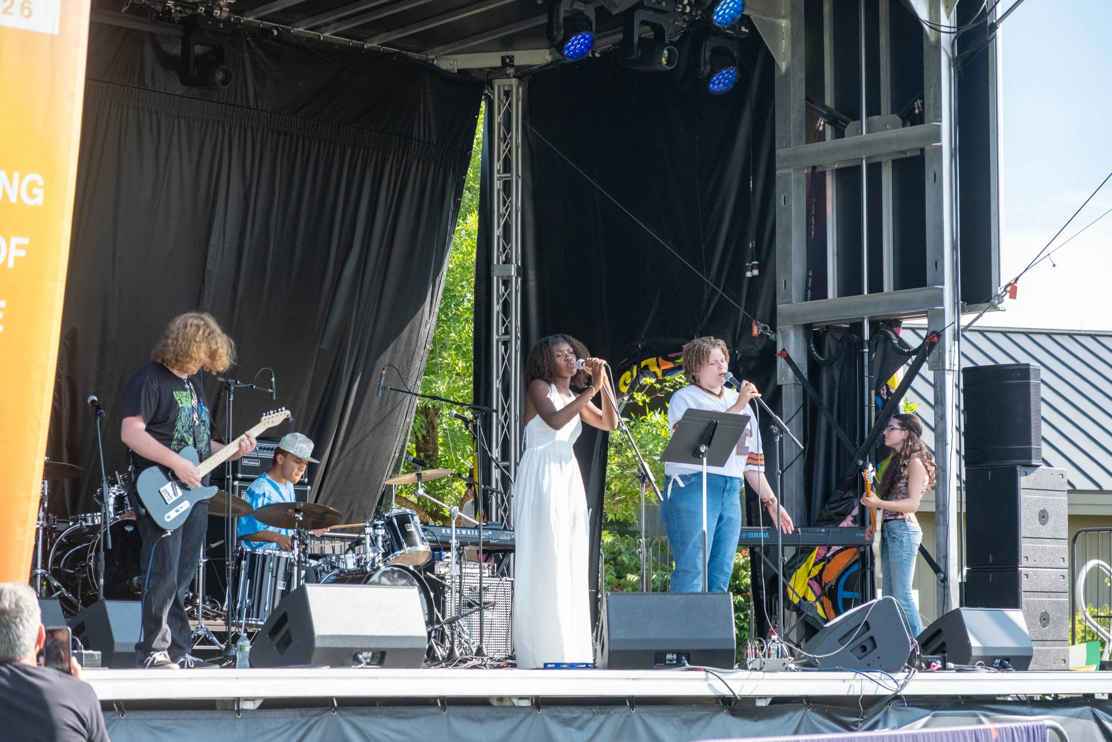 Young musicians perform on the Horizon Stage during the anniversary celebration.