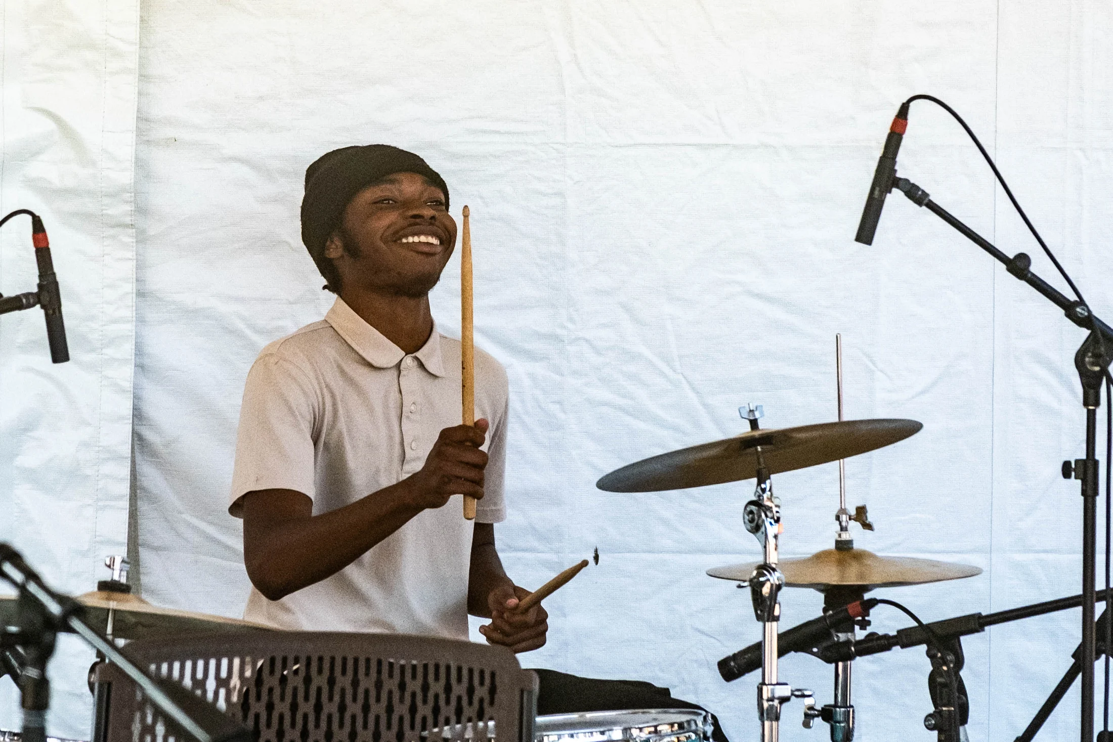 A drummer performs on the Community Stage at Bethel Woods.