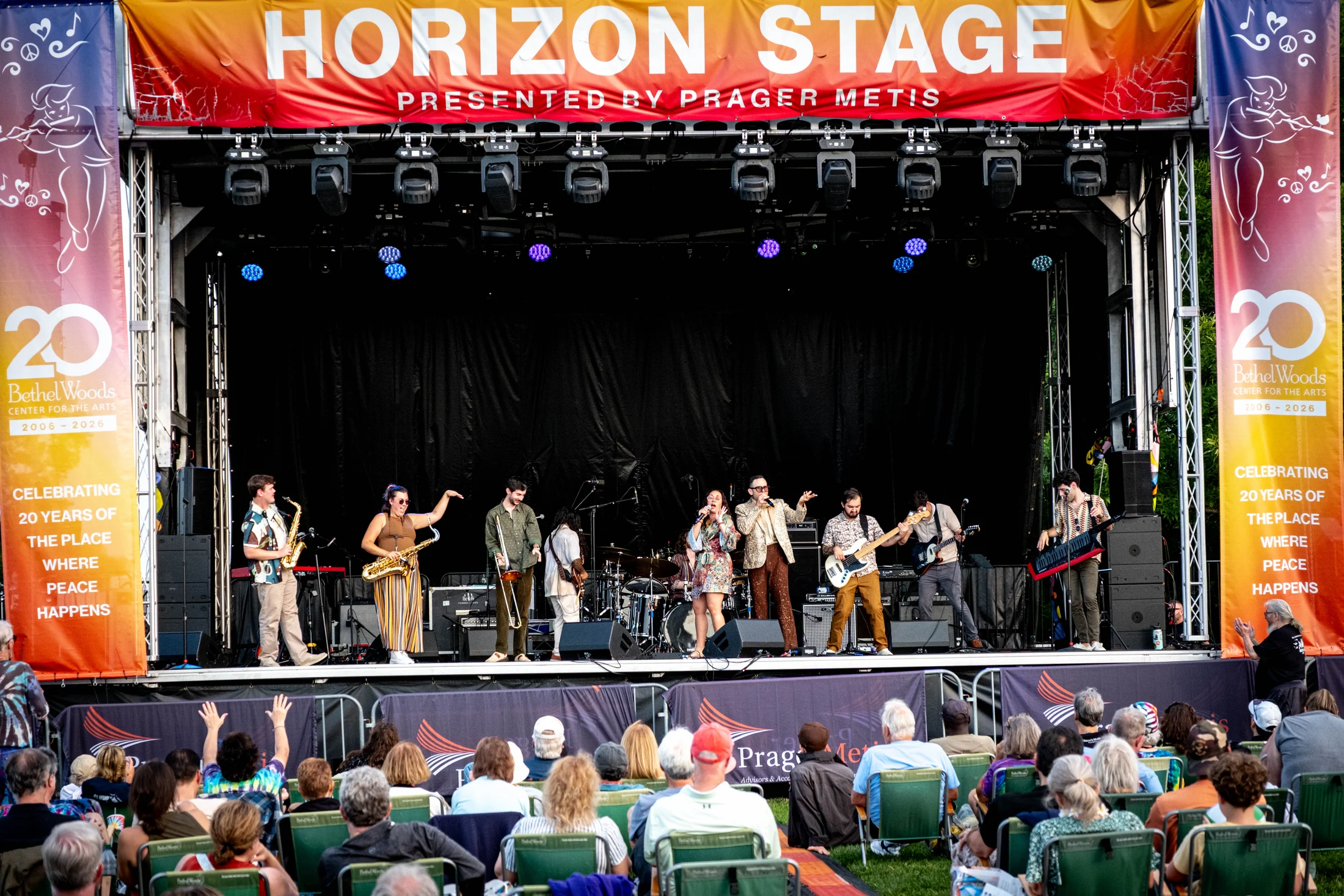 Musicians and concertgoers gather at the Horizon Stage.