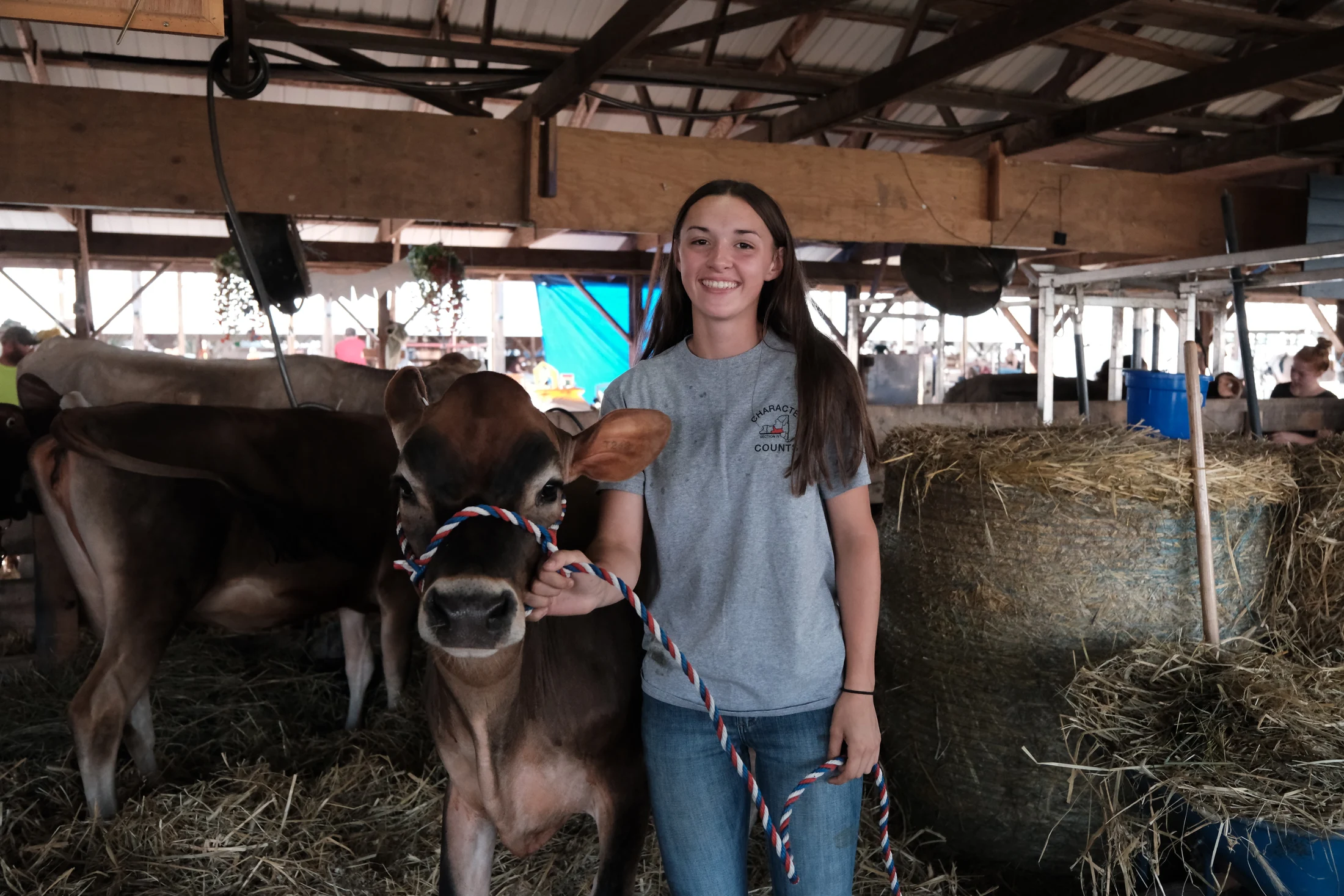 Hannah Tuttle, 17, of Windham poses with one of her Jersey cows at the Delaware County Fair. Tuttle has been involved in 4-H since age 9 and has shown cows since age 5. She plans to attend Mansfield University to study business management.