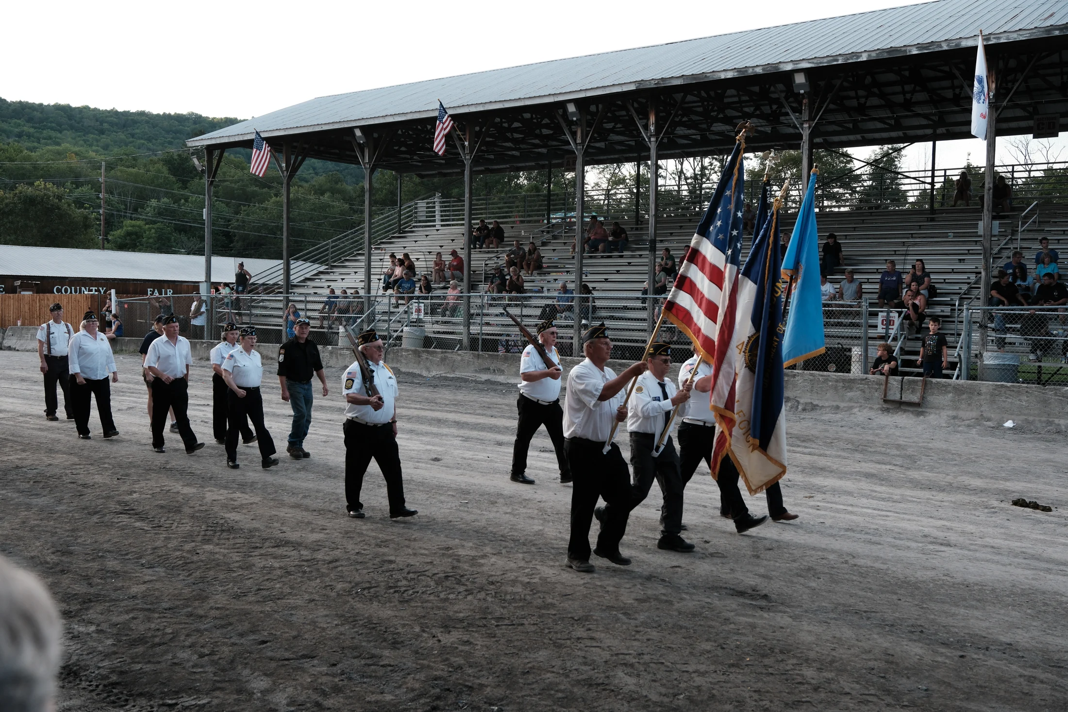 Veterans and members of local organizations carry the colors through the grandstand during the Delaware County Fair Heroes Parade.